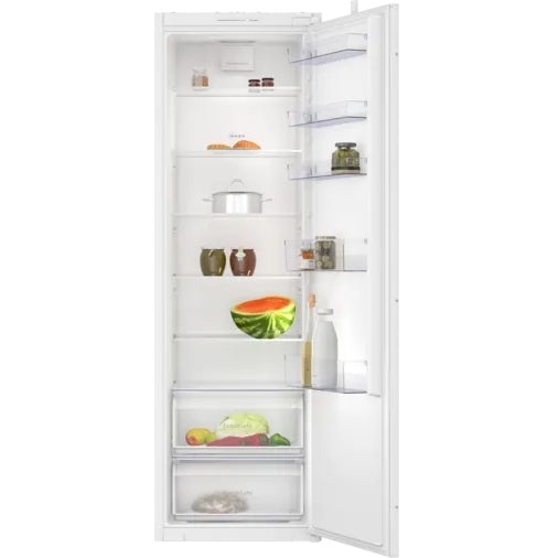White refrigerator with open door displaying various food items on a white background