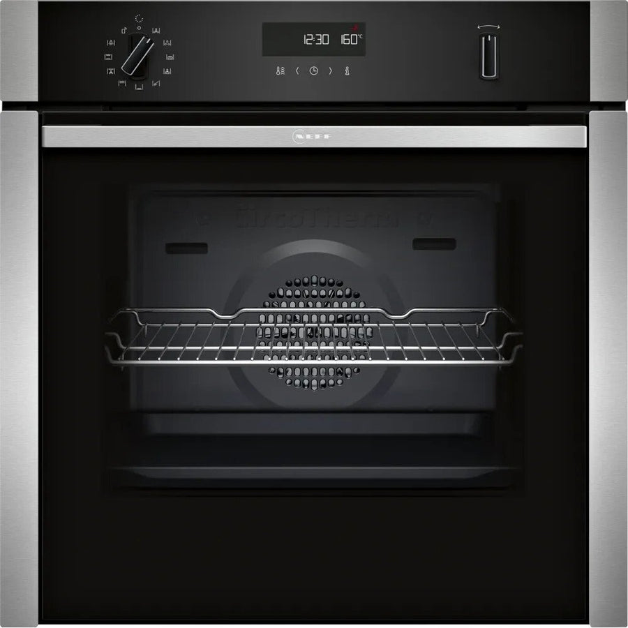 Neff slide and hide oven with digital display and control panel on a black background


